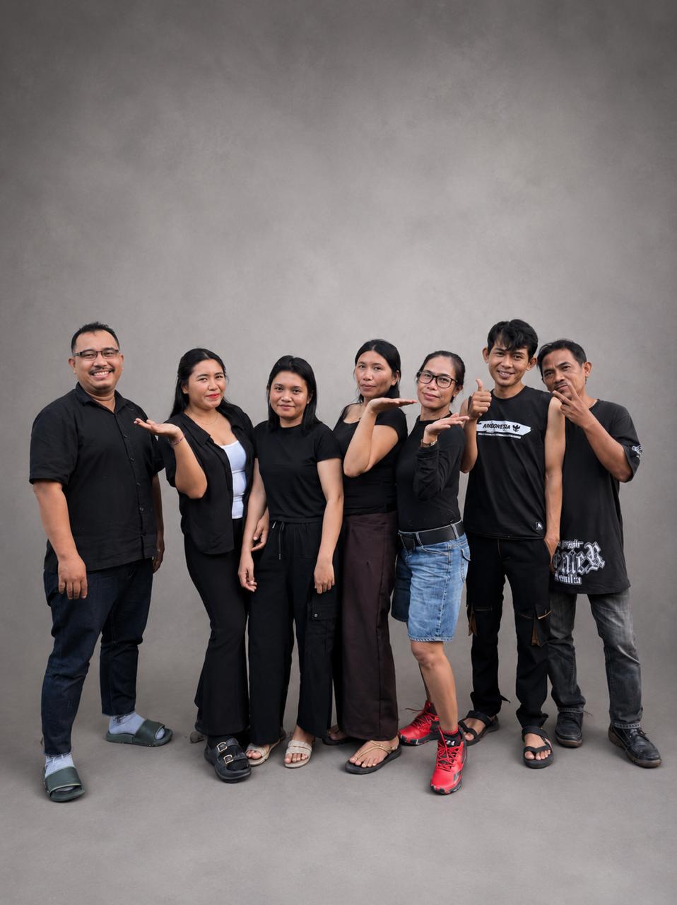 Group photo of the dedicated tailors, pattern makers, and production team at MARI Garment, a premium clothing manufacturer in Bali.