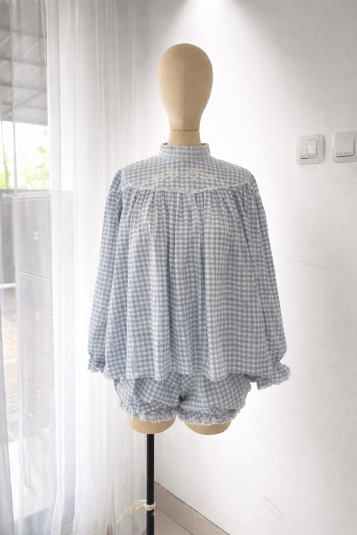 Light blue gingham top and bloomers set with delicate embroidery, manufactured by MARI Garment clothing production in Bali.