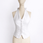 Chic white halter neck vest with button detailing, custom produced by MARI Garment manufacturer in Bali.